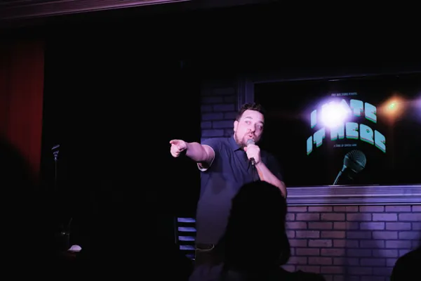 Dan pointing toward the audience during a show